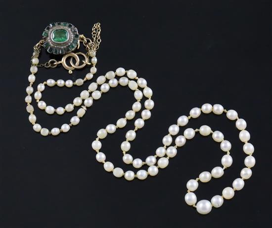 A single strand graduated cultured pearl necklace with emerald cluster set clasp, 50cm.